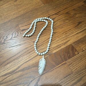 Mint green beaded necklace with feather pendant